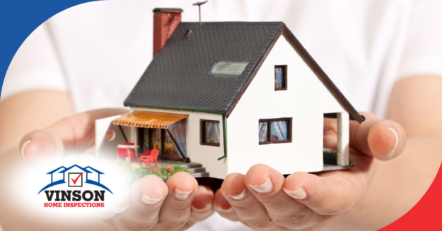 Vinson Home Inspections (8) Hands holding a model house representing home protection and inspection services.