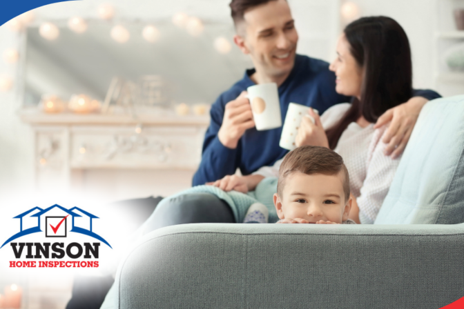 Vinson Home Inspections (9) Young family relaxing on a cozy couch, sharing a warm moment at home.