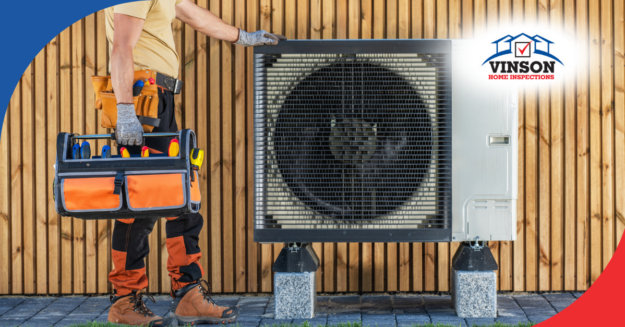 HVAC technician standing next to an outdoor unit with a tool bag in hand.